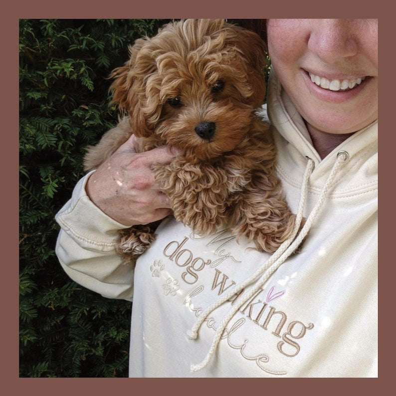 Custom embroidered dog walking hoodie with names on sleeve